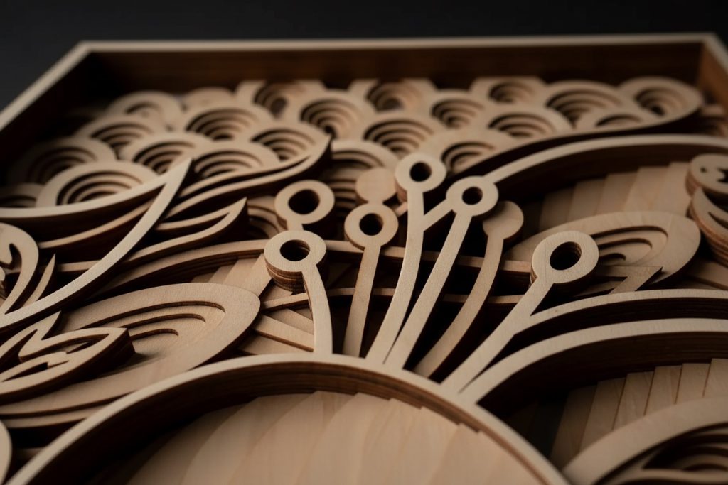 Close-up of layered laser-cut wooden wall art